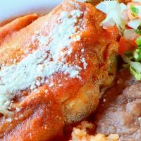 Chile Relleno · Roasted poblano pepper stuffed with queso fresco, topped with tomato sauce and served with r...