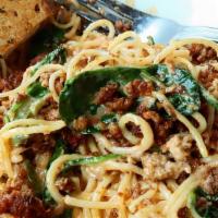 Chorizo Fire Pasta · Crumble chorizo sautéed with jalapeños, tomatoes, and spinach, tossed with linguini pasta  s...