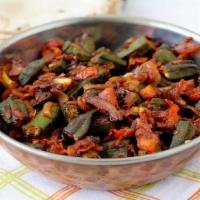 Bendi (Okra) Fry · Bendi (Okra) simmered with
freshly ground Indian spices and fried