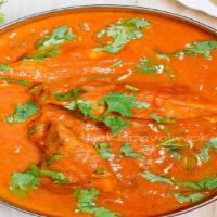 Fish Korma · Fish cooked with Onions,
tomatoes and spices