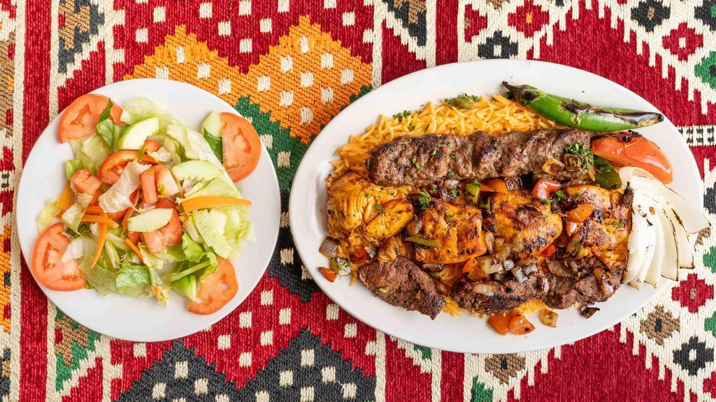 Combination Kabob Platter · All three kabobs (chicken, kafta and steak). Served with rice, grilled onion, pepper, tomato, Arabic salad and pita.