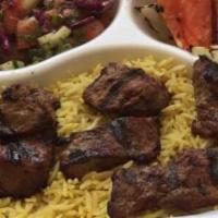 Steak Kabob Platter · Medallions of beef tenderloin charbroiled to perfection. Served with rice, grilled onion, pe...