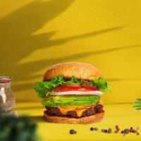 Cadet Cado Burger · Crispy vegan falafel patty topped with tahini, avocado, lettuce, tomato, onion, and pickles....