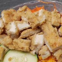 Chicken Supreme Salad · House salad with fried chicken.