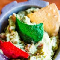 Tableside Guacamole & Homemade Chips · Our famous avocado dip prepared tableside.