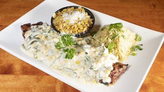 Carne Asada Con Rajas Poblanas · 10 oz. skirt steak topped with creamy roasted rajas poblanas ang queso cojita. Served with cilantro lime rice and roasted corn.