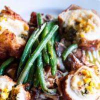 Pollo Relleno · Breaded chicken roulade stuffed with chorizo, sweet corn, poblano peppers, and asadero chees...