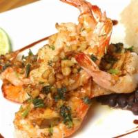 Camarones Al Mojo De Ajo · Shrimp topped with our specialty fresh garlic, finished off with a touch of butter, cilantro...