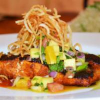 Salmon A La Talla · Pan seared achiote adobo salmon, mango pico de gallo, cilantro lime rice and caramelized pla...