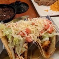Tacos · Two corn tortilla tacos with your choice of chicken, ground beef, chorizo, guacamole, or veg...