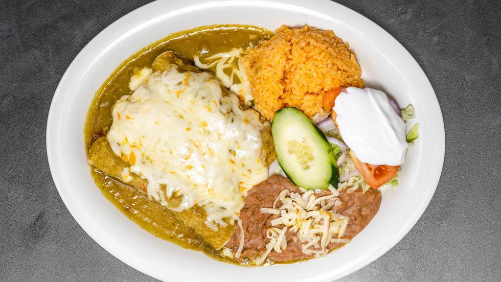 Enchiladas Verdes / Green Enchiladas · Three enchiladas filled with your choice of meat and topped with green tomatillo sauce, melted cheese and sour cream. Served with rice, beans, and salad.