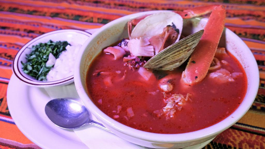 Caldo De Mariscos · Seafood soup with catfish, shrimp, surimi, calamari, clam, octopus and crab legs.