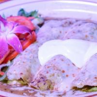 Enchiladas (3) · Stuffed with choice of chicken or cheese and topped with red, green, tomato, or mole sauce (...