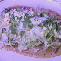 Huaraches · Your choice of filling and beans. lettuce tomato cheese green sauce and sour cream on the top.
