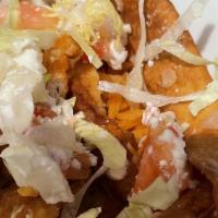 Taco Salad · Grilled or crispy chicken breast, bacon, tomatoes, corn, and cheddar cheese. Served with hom...