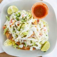 Tostadas · 3 crunchy fried corn tortillas. Topped with lettuce, tomatoes, onions, cilantro, sour cream,...