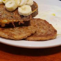 Banana Nut Bread French Toast · Homemade in our kitchen topped with banana slices.