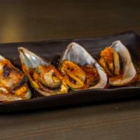 Green Mussels · Four pieces. Baked green mussels, spicy sauce, Japanese mayo, green onion, and Japanese pepp...