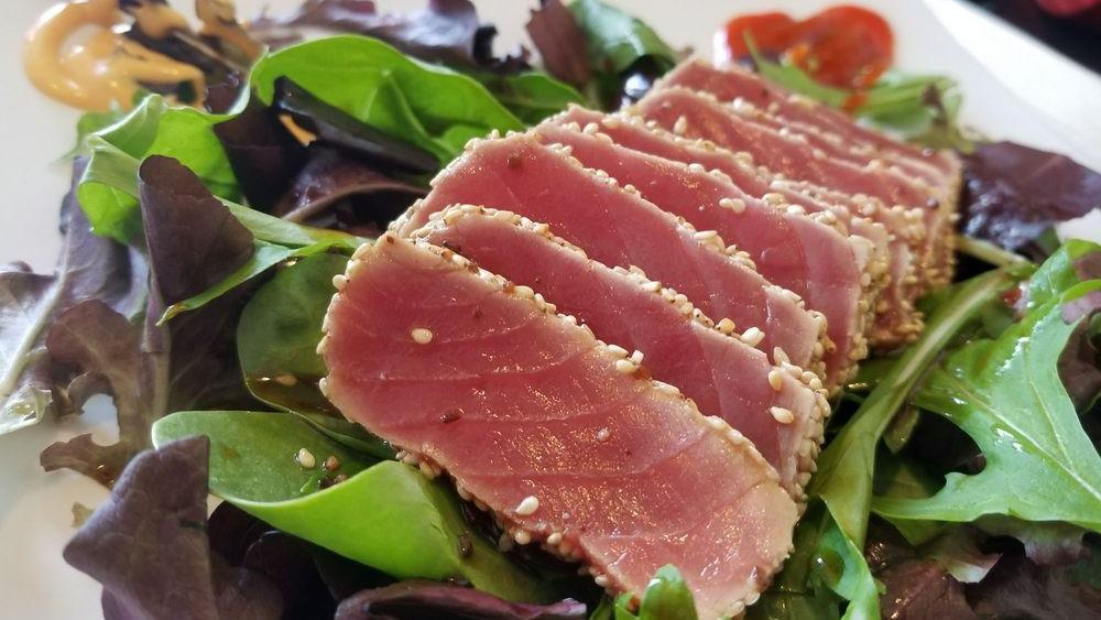 Seared Tuna Salad · Seared tuna, sesame seeds, spring mix, and Goma sauce.