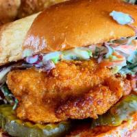 Chicken Sandwich · Boneless chicken breast topped with pickles and slaw.