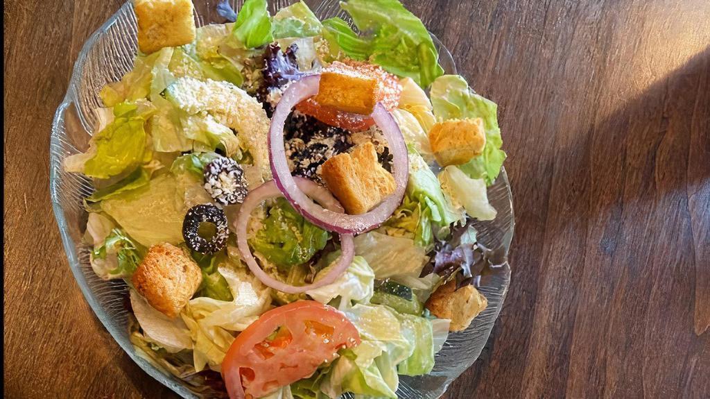 Caesar · Romaine lettuce, parmesan cheese and croutons.