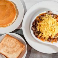 Butcher Shop Skillet · A skillet full of hash browns mixed with bacon, ham and sausage, topped with melted jack and...