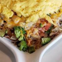Vegetarian Skillet · A skillet full of hash browns with broccoli, onions, mushrooms, green peppers, and tomatoes,...