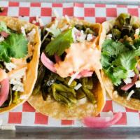 Rajas Con Queso Taco · 3 tacos. Choice of flour or corn tortilla. Cactus, roasted poblano peppers, pickled onions, ...