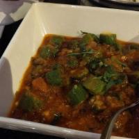 V-16. Bhindi Masala · Fresh okra fried with bell peppers, onions, and spices.