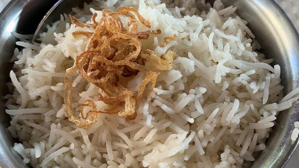 R-6. Coconut Rice · Aromatic basmati rice cooked in mustard seeds, curry leaves, coconut, and ginger.