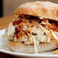 Smothered Pulled Chicken Sandwich · Coleslaw & Red Sauce