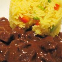 Beef Curry  · Curry seasoned beef, simmered in Housemade Red Curry sauce and served over Saffron basmati r...