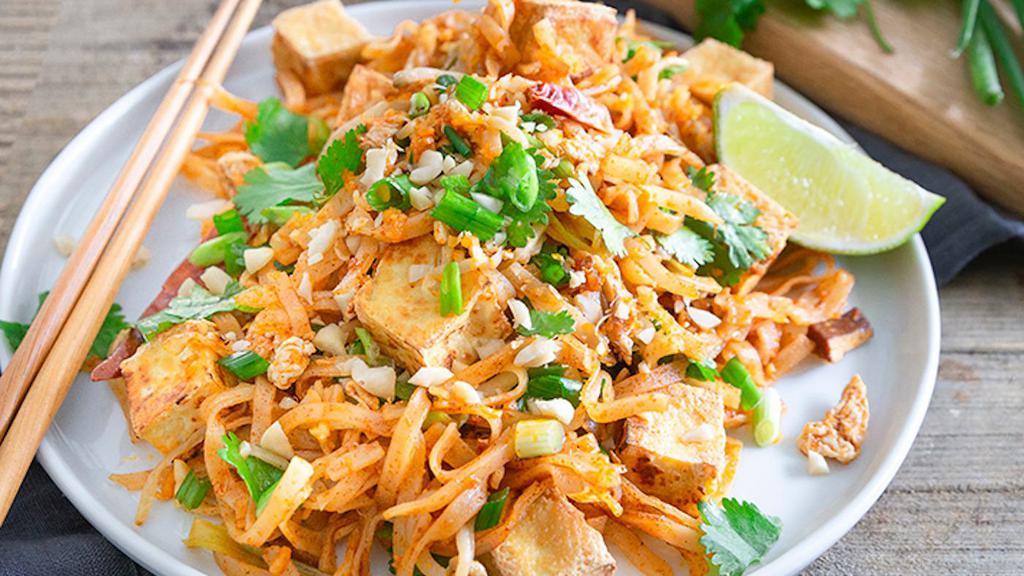 Pad Thai Tofu · Spicy. Thai rice noodle stir fried with bean sprouts, eggs, green onions and carrots. Tofu in Thai flavor sauce. Topped with crushed peanuts.