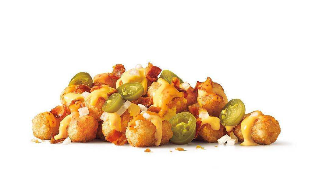 Large Order Of Totchos · Our twist on nachos -
Famous Tater Tots topped with onions, bacon, jalapenos, baja and cheddar cheeses in a bowl