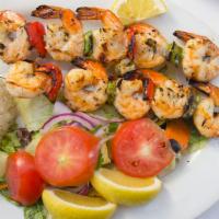 Grilled Shrimp · Jumbo shrimp skewered and flame grilled with garlic sauce. Served with rice pilaf and mixed ...