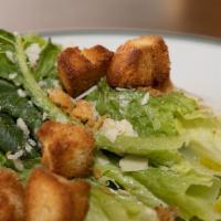 Caesar Salad · Romaine lettuce, traditional dressing, croutons, and parmesan frico.