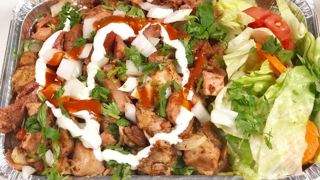 Grilled Chicken Over Rice  · Well marinated chicken grilled and chopped into cubes served with basmati rice (white or brown) with the choice of white, hot, green or bbq sauce.