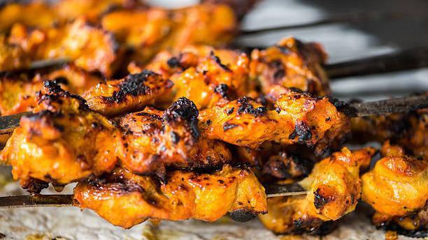 Chicken Tikka · Grilled Chicken breast cubes marinated with selected spices for best taste and aroma served with basmati rice (white or brown) with the choice of white, hot, green or bbq sauce