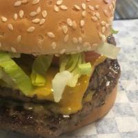 Cheeseburger · with fires and sode. Lettuce, tomato, onion, pickle, ketchup, and mustard.