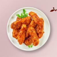 Bbq Chicken Tenders · Chicken tenders breaded and fried until golden brown, tossed in BBQ sauce. Served with your ...