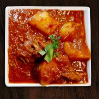 Chicken Vindaloo (Hot) · A delicious combination of chicken and potatoes marinated in vinegar, hot pepper and spices ...