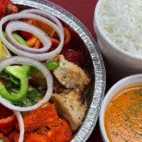 Tandoori Platter · A chef's assortment of tandoori meats: tandoori chicken, chicken tikka, lamb seekh kebab, mu...