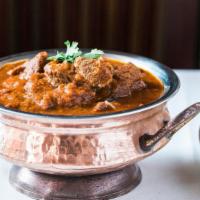 Lamb Vindaloo (Hot) · A delicious combination of lamb and potatoes marinated in vinegar, hot peppers, and spices c...