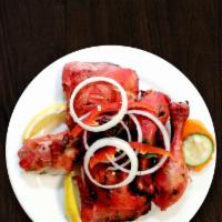 Chicken Tikka · Succulent cubes of boneless chicken breast marinated in yogurt mild spices and roasted in a ...