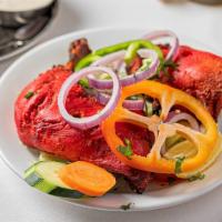 Tandoori Chicken (Half) · Chicken marinated in yogurt and blended with colorful Indian herbs and spices and roasted in...