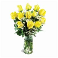 A Dozen Yellow Long Stem Roses · Vase of twelve roses with baby's breath and mixed greens.