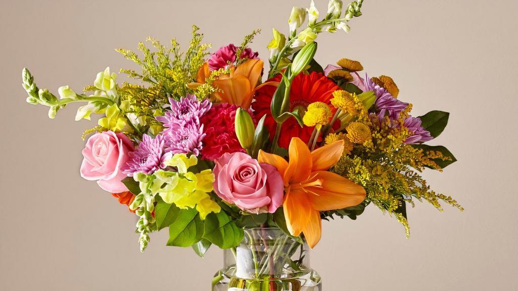 Ftd Party Punch Bouquet · Garden style vase of flowers.