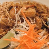 Pad Thai · thin rice noodle, egg, bean sprout, green onion, ground peanut, cabbage, carrot, and lime on...