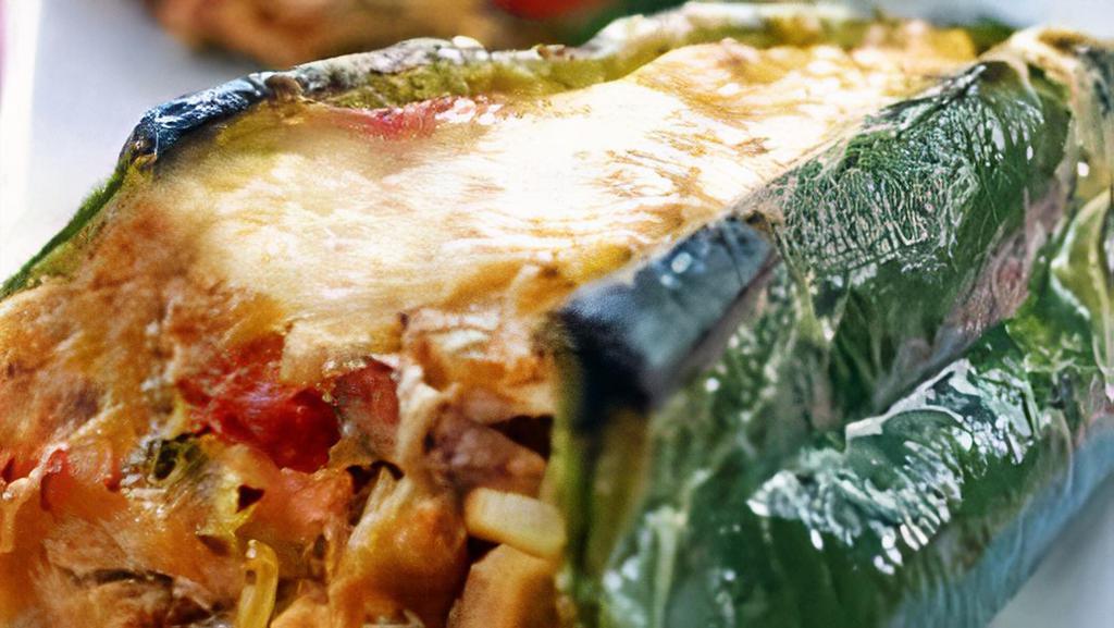 ) Stuffed Poblano Pepper · Spicy. Poblano pepper, fat free refried beans, jasmine rice, lean hamburger, cheese garnish. Macros: Calories: 215. Protein: 22 g. Carbs: 25 g. Fats: 3 g.