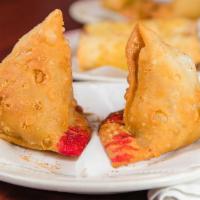 Meat Samosa (1 Piece) · Ground meat mixed with chili onion and herbs.